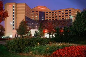 a hotel building with a sign on top of it at Sheraton Detroit Metro Airport in Romulus