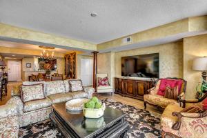 a living room with a couch and a table at Ocean Blue 902 in Myrtle Beach