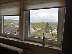 a window with a view of a town at Flat in Polle near the forest in Polle