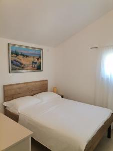 Postel nebo postele na pokoji v ubytování Holiday Batarelo