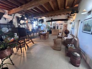 a large living room with a table and chairs at Hotel e B&B Il Mulino in Vaiano