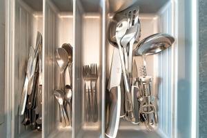a drawer filled with utensils in a refrigerator at Lyon Cité- Appartement vue Rhône terrasse-Caluire in Caluire-et-Cuire