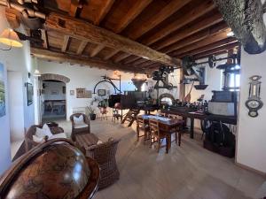 a large living room with a table and chairs at Hotel e B&B Il Mulino in Vaiano