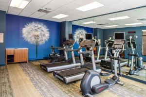 a gym with treadmills and ellipticals in a room at SpringHill Suites by Marriott Deadwood in Deadwood