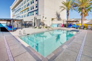 a large swimming pool in front of a building at Aloft Tucson University in Tucson