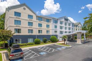 a hotel with a car parked in a parking lot at Fairfield Inn Myrtle Beach North in Myrtle Beach