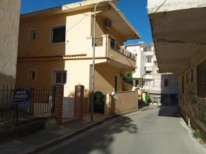 an empty street in front of a building at Saranda Apartments in Sarandë