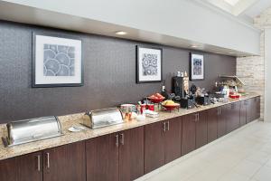 a kitchen with a long counter in a room at Residence Inn Chicago O'Hare in Rosemont