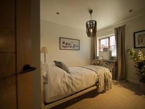 a bedroom with a bed and a window at Brookwood in Pickering