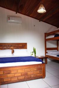 Tempat tidur dalam kamar di Pousada Paradise Flecheiras