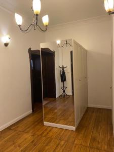 an empty room with a mirror and a hallway at Apt * Stella in Wrocław