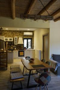 A kitchen or kitchenette at by karakas Λίθινο