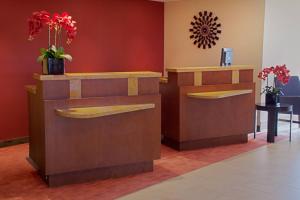 a waiting room with flowers on the wall at Courtyard by Marriott Key Largo in Key Largo