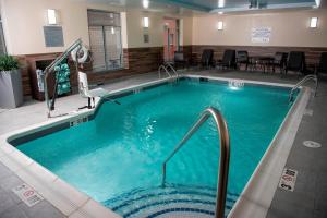 a large swimming pool in a hotel room at Fairfield Inn & Suites by Marriott Cincinnati Uptown/University Area in Cincinnati
