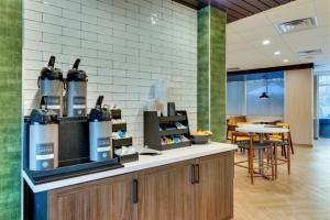 a wine bar with bottles of wine on a counter at Fairfield by Marriott Inn & Suites Dalton in Dalton