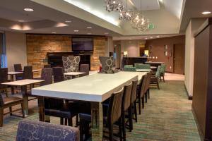 a large dining room with a large table and chairs at Residence Inn by Marriott Sebring in Sebring