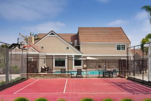 a tennis court in front of a house at Residence Inn Costa Mesa Newport Beach in Costa Mesa