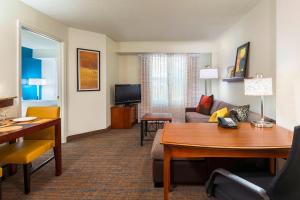 a living room with a couch and a table at Residence Inn Tampa Westshore Airport in Tampa