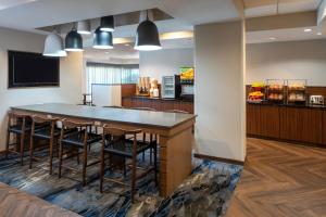 a restaurant with a large table and chairs at Fairfield Inn & Suites by Marriott Destin in Destin