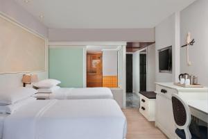Sheraton Samui Resort客房内的一张或多张床位