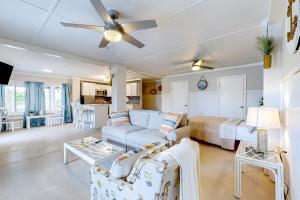 a living room with a couch and a bed at 7213 Flood Reef - Unit 4 in Pensacola