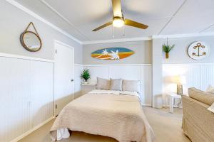 a bedroom with a bed and a ceiling fan at 7213 Flood Reef - Unit 4 in Pensacola