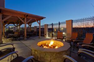 a fire pit on a patio with chairs and tables at Courtyard Philadelphia Great Valley/Malvern in Malvern