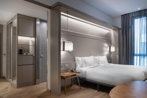 Postel nebo postele na pokoji v ubytování AC Hotel Recoletos by Marriott