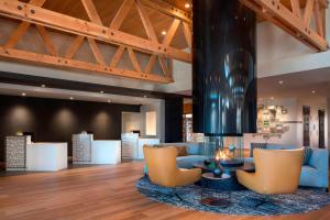 a lobby with couches and a fireplace in a building at Residence Inn by Marriott Redwood City San Carlos in San Carlos