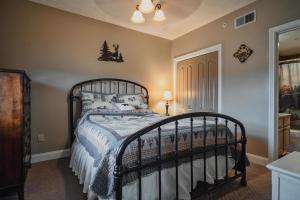 a bedroom with a bed with a black frame at Gv - Unit 1502 - Happy Time Bear in Pigeon Forge