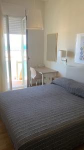 Postel nebo postele na pokoji v ubytování Hotel Rosati