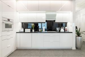 Kuchyň nebo kuchyňský kout v ubytování Apartamenty Glamour Giżycko