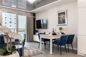 TV a/nebo společenská místnost v ubytování Apartamenty Glamour Giżycko