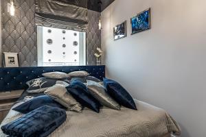 Postel nebo postele na pokoji v ubytování Apartamenty Glamour Giżycko