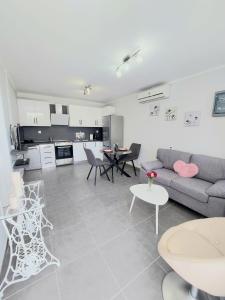 a living room with a couch and a table at Villa Gardiki for2 in Halikounas