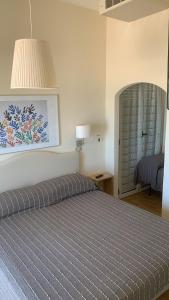 Postel nebo postele na pokoji v ubytování Hotel Rosati
