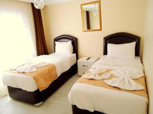 Postel nebo postele na pokoji v ubytování Tolga Hotel