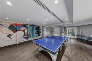 a room with a ping pong table in it at The Ven at Embassy Row, Washington, D.C., a Tribute Portfolio Hotel in Washington, D.C.