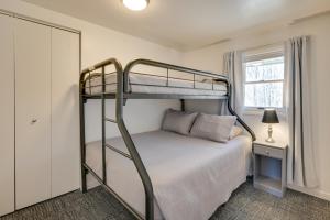 a bedroom with a bunk bed and a mirror at Woodsy Family Retreat 11 Mi to Raystown Lake! 