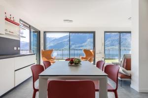 a kitchen and dining room with a table and chairs at Apartment Lana, Gera Lario in Gera Lario