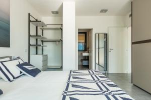 a bedroom with a large bed and a staircase at Apartment Lana - Gera Lario in Gera Lario +51 photos
