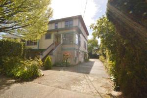 a large house with a sidewalk in front of it at Marketa's Bed and Breakfast in Victoria