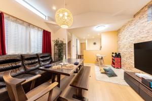Una televisión o centro de entretenimiento en CuteFamilyHouse! 3LDK 6minShinjuku 3minJRsta Cozy,Fun,Bright! KidsFree Under6yrs