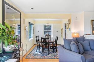 a living room with a blue couch and a table at Magnolia on the Hill in Seattle +16 photos