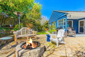 a backyard with a fire pit and a bench at Magnolia on the Hill in Seattle