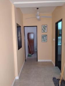 a hallway with a ceiling fan in a room at Los Girasoles del Sur in Wilde