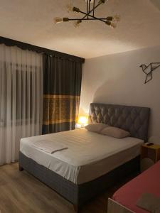 Postel nebo postele na pokoji v ubytování ZANI Hostel