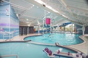 a large swimming pool in a large building at Luxury caravan at Seton Sands in Port Seton