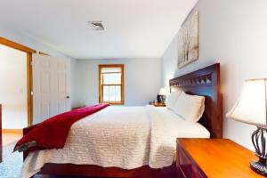 Un pat sau paturi într-o cameră la Joan's Joy
