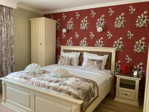 En eller flere senge i et værelse på Vila Royal Mangalia